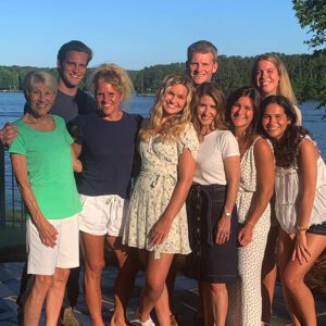 family picture in front of the lake with Denise